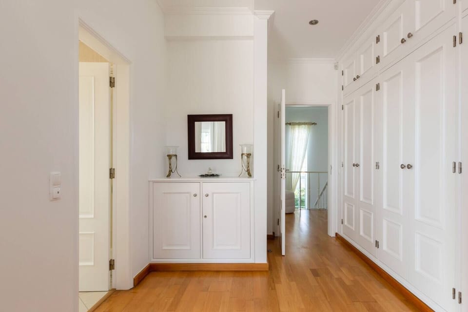 Master bedroom wardrobes with en-suite bathroom on the left