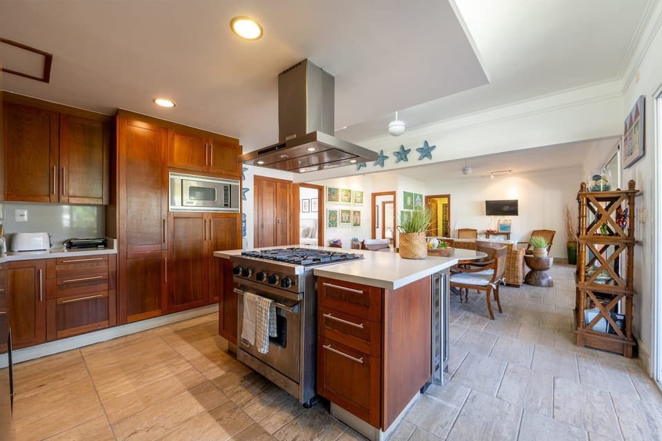 Fully equipped kitchen with washer and dryer, plus a private service room ideal for a live-in maid or extra help.