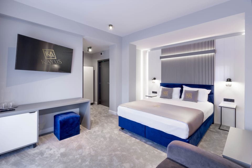Family Double Room | Minibar, desk, laptop workspace, blackout drapes