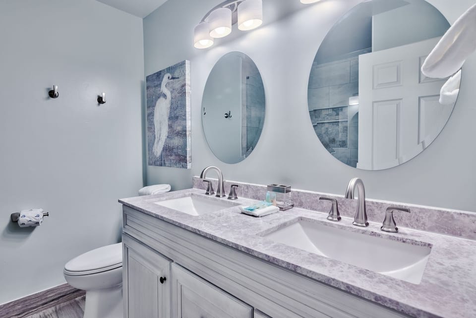 Double vanity w/ lots big drawers for storage.  Towel hooks too!