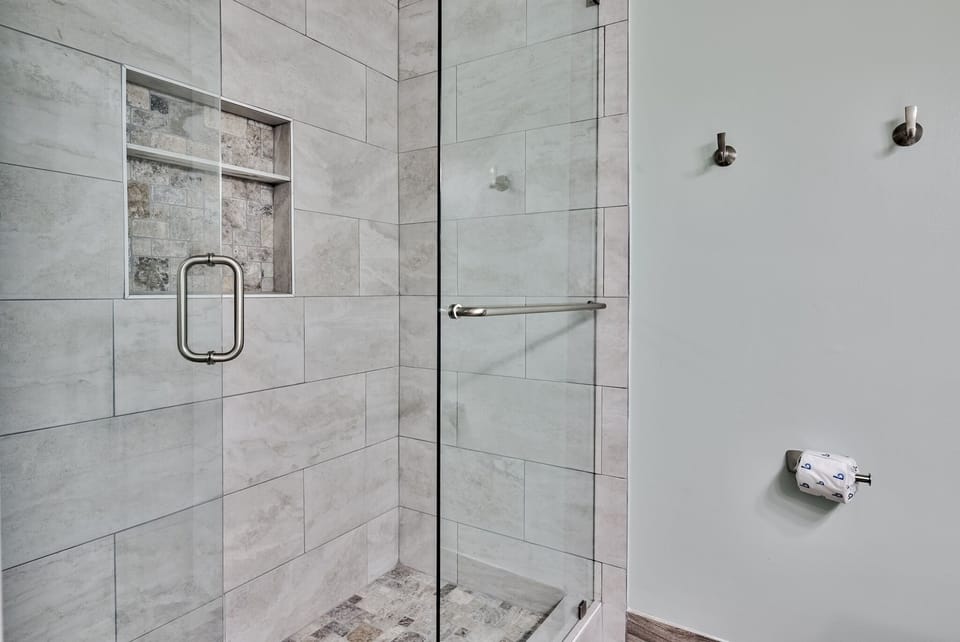 Brand new tiled shower. Soooo spacious and lots of shelf room!!