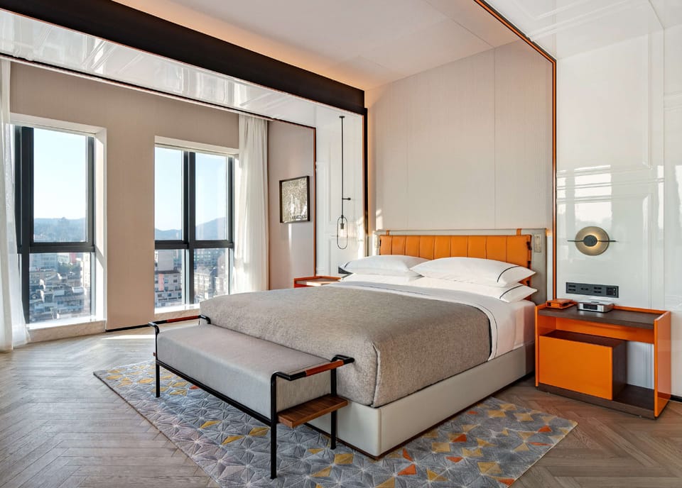 Premium bedding, down comforters, minibar, in-room safe