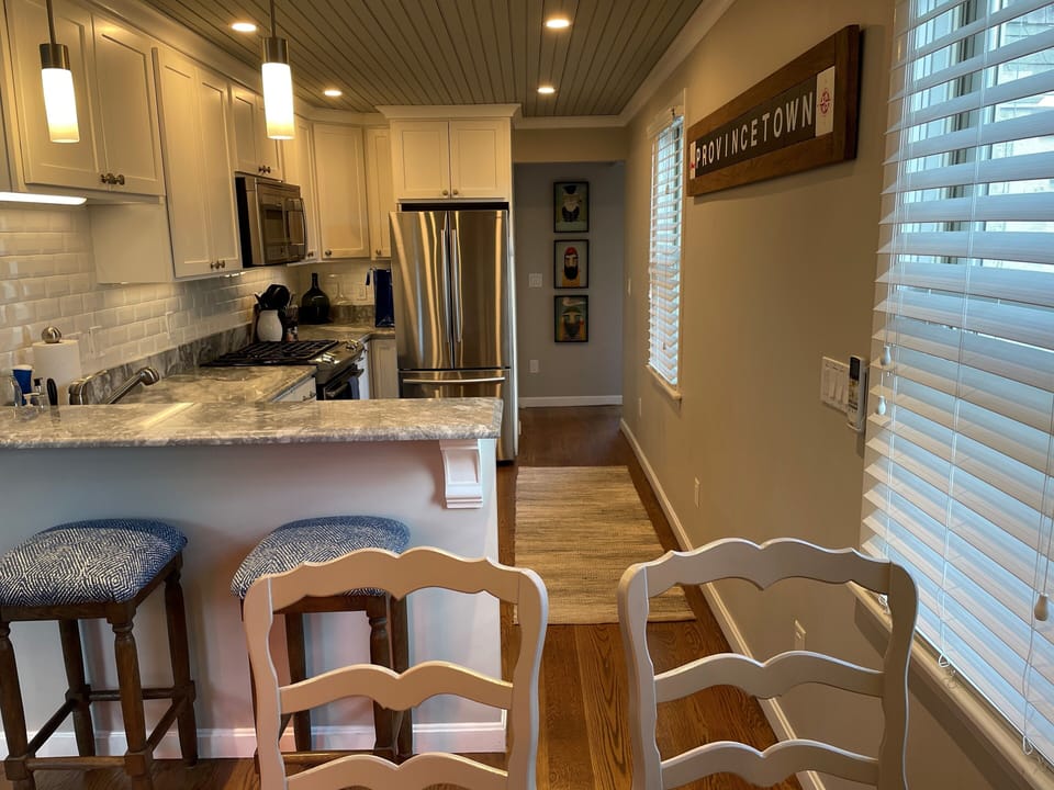 Dining room looking into kitchen and back hallway