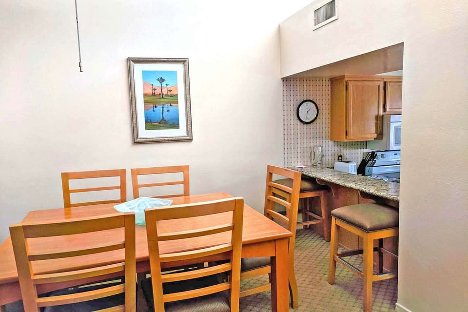 Dining area has bar stools for extra seating if needed.