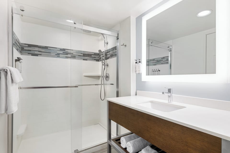 Designer toiletries, hair dryer, towels