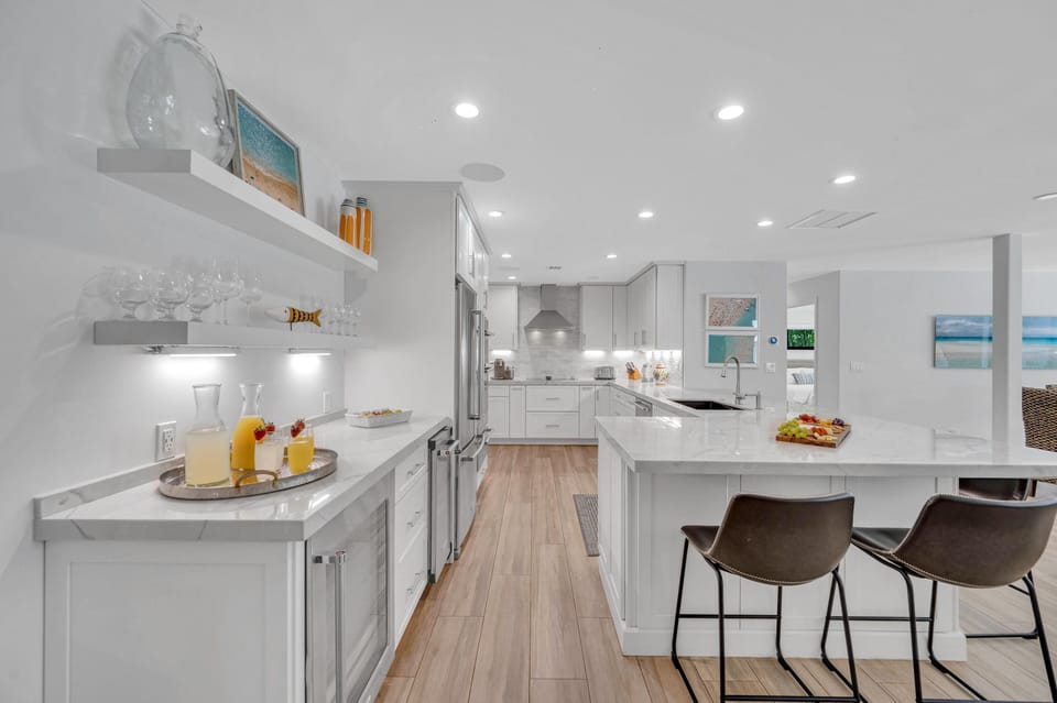 Prepare sumptuous meals from the spacious Chef's kitchen also featuring a wine cellar.