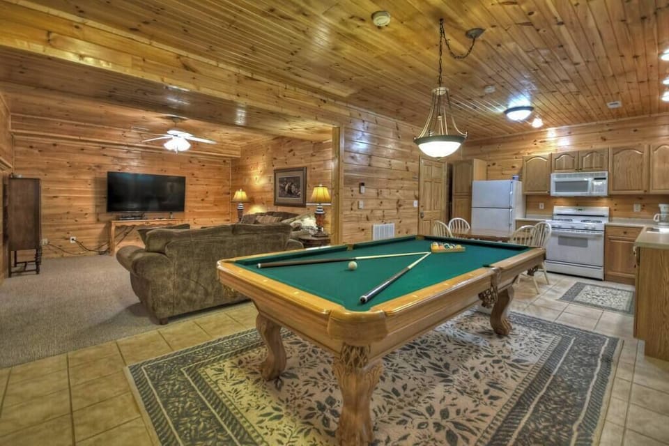 Pool table, 2nd kitchen, and living room in the lower level