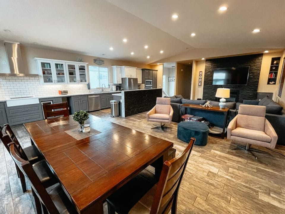 Open concept living area with dining table to seat 8.