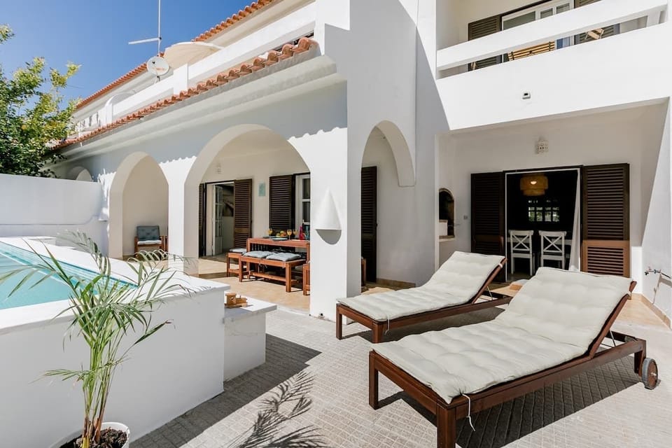 Outside space with dinning area, pool, BBQ and sun lounges