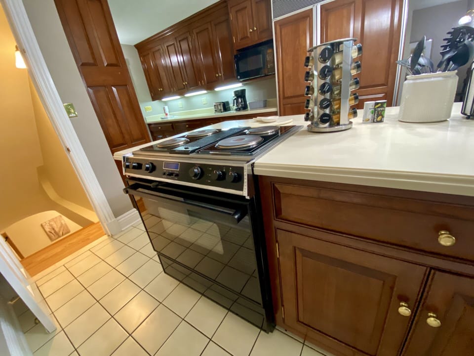 Stovetop and Oven - Stairs Leading to the Downstairs Master