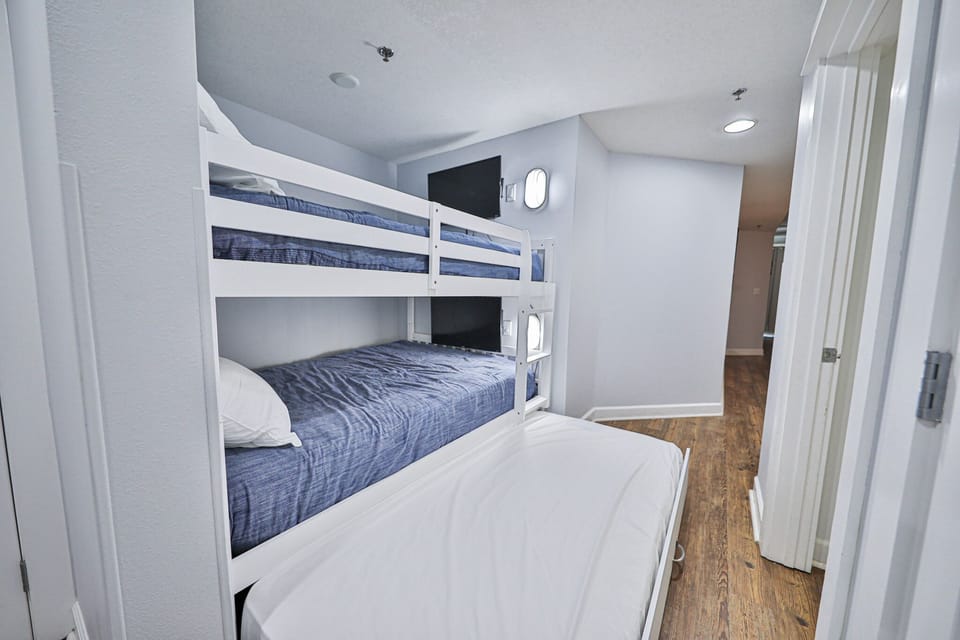 Twin size trundle bed under the bunks.