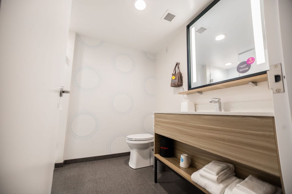 Room, 2 Queen Beds | Bathroom | Shower, hair dryer, towels