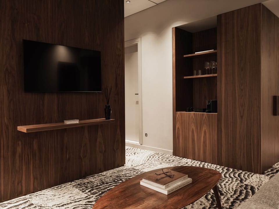 Deluxe Suite with Garden View | Living area | 42-inch LCD TV with satellite channels, TV, pay movies