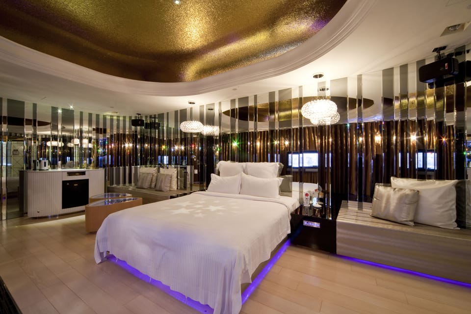 Premium bedding, down comforters, pillowtop beds, free minibar