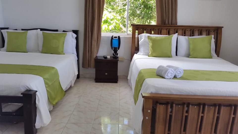 Standard Quadruple Room, Multiple Beds | In-room safe, WiFi (free), bed sheets
