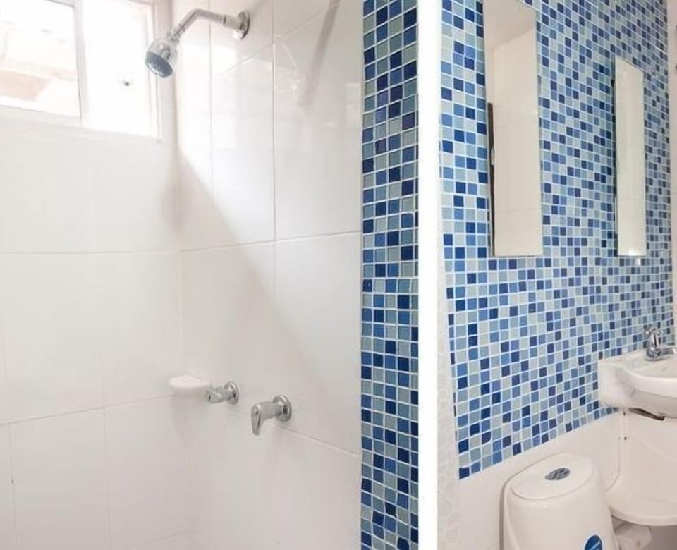 Standard Triple Room, 1 Bedroom | Bathroom | Rainfall showerhead, free toiletries, hair dryer (on request), towels