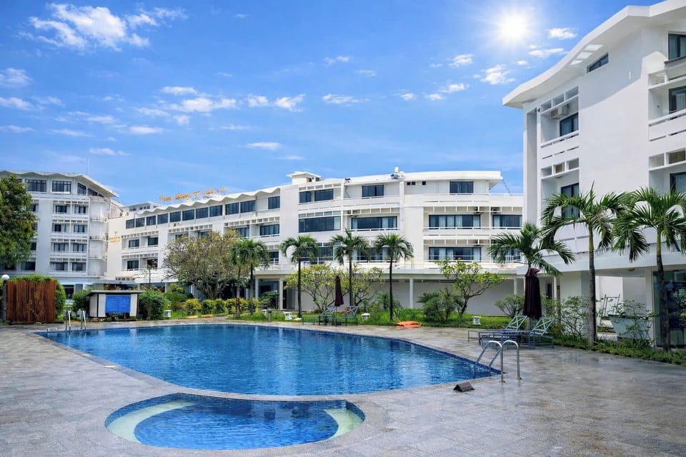 Outdoor pool, open 8:00 AM to 8:00 PM, pool umbrellas