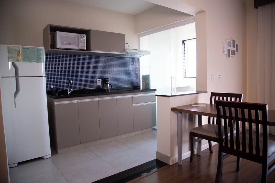 Full-size fridge, microwave, stovetop, cookware/dishes/utensils