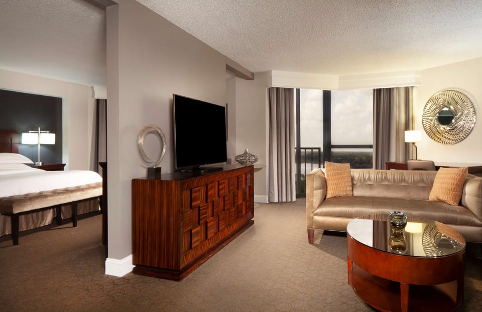 Suite, 1 Bedroom, Balcony, Pool View | Living area | 42-inch flat-screen TV with cable channels, TV