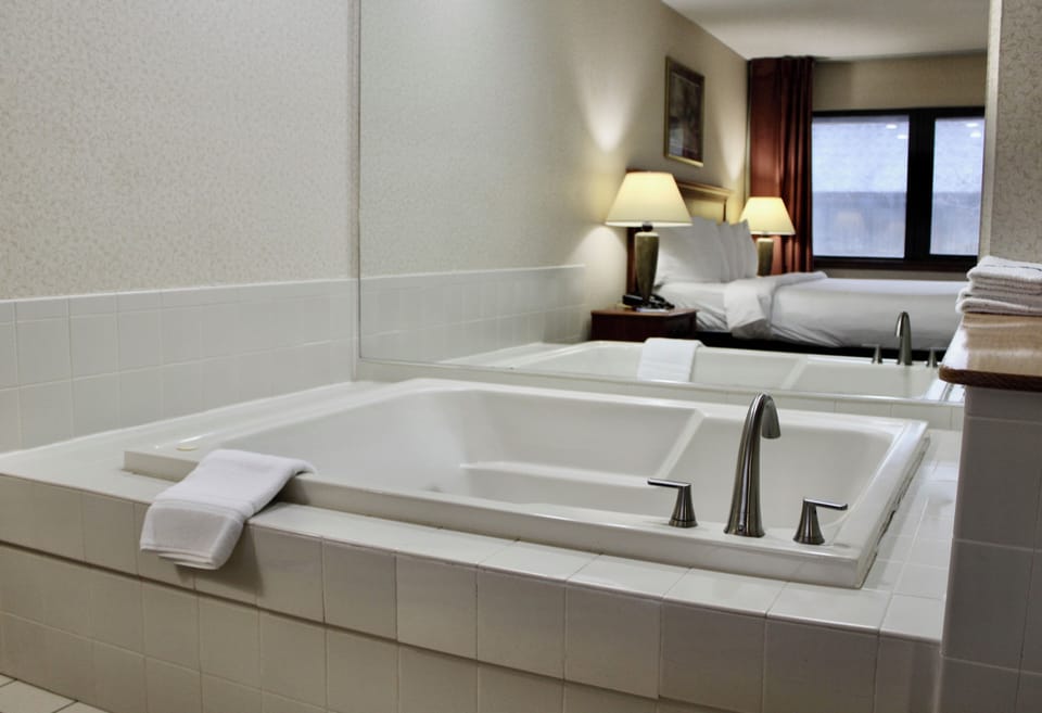 Suite, 1 King Bed, Jetted Tub | Premium bedding, pillowtop beds, blackout drapes, iron/ironing board