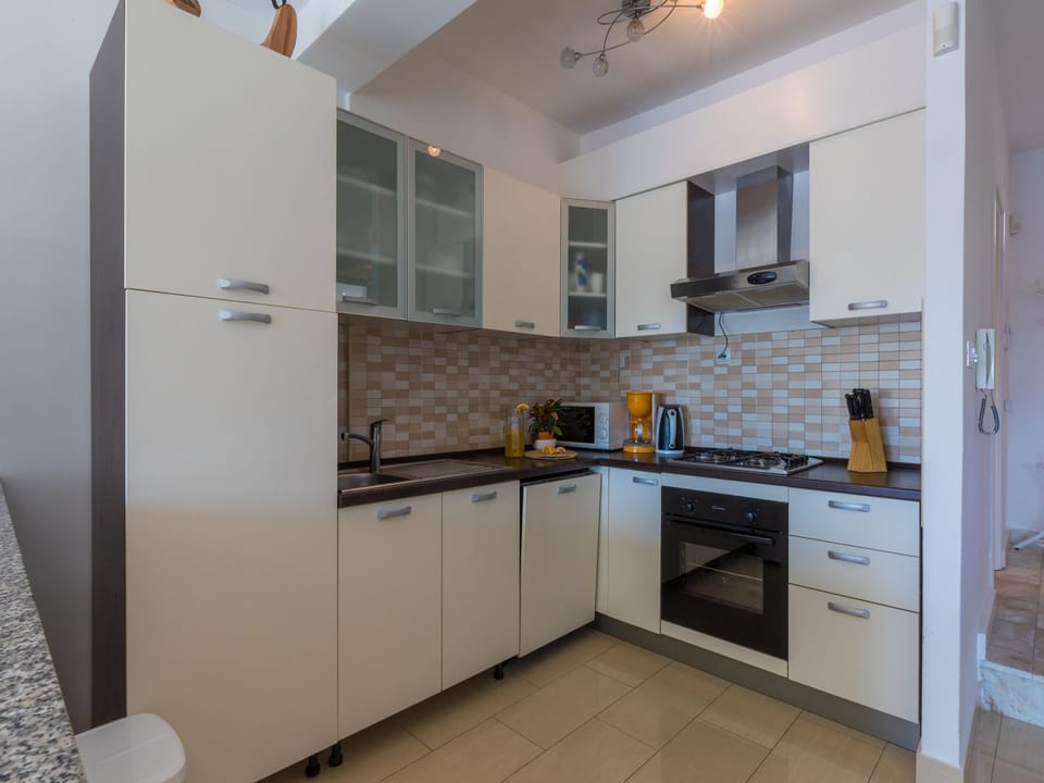 Villa | Private kitchen | Fridge, microwave, oven, stovetop
