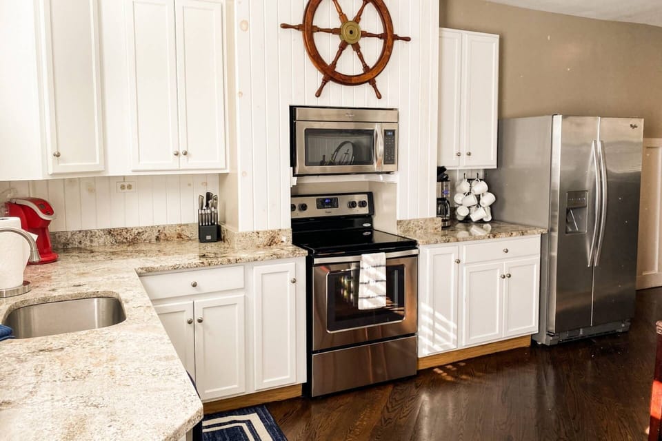 The full laundry room is attached to the Naval Academy-themed kitchen
