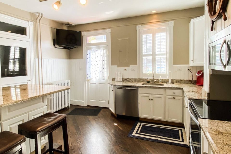 Enter into the bright kitchen from the two parking spots