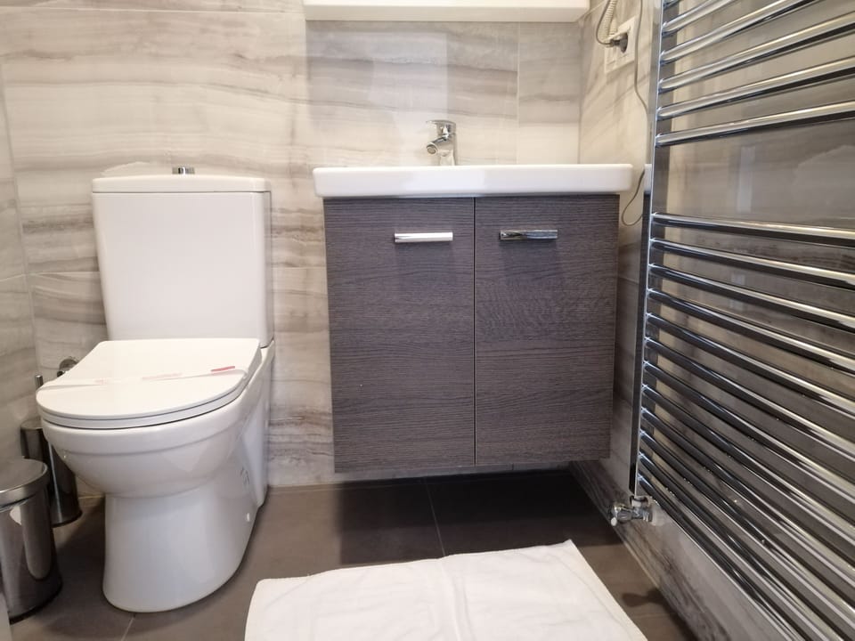 Family Room, Connecting Rooms | Bathroom | Shower, free toiletries, hair dryer, slippers