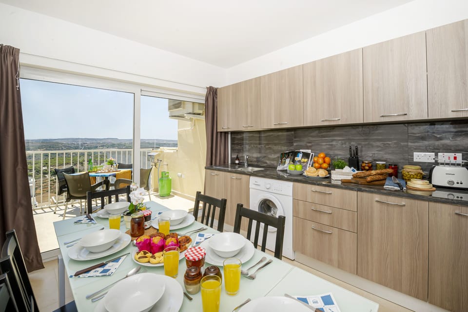 Fully equipped kitchen and dining area with panoramic views