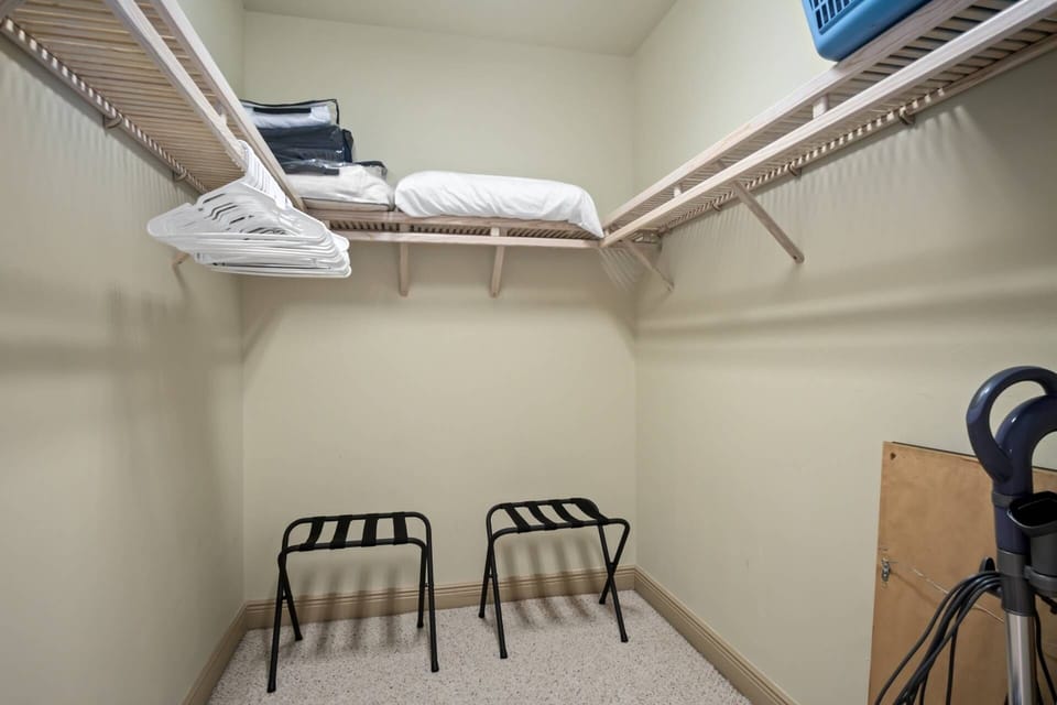 The master walk-in closet offers ample hanging in storage space.
