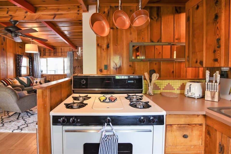 A kitchen that is open to the living room