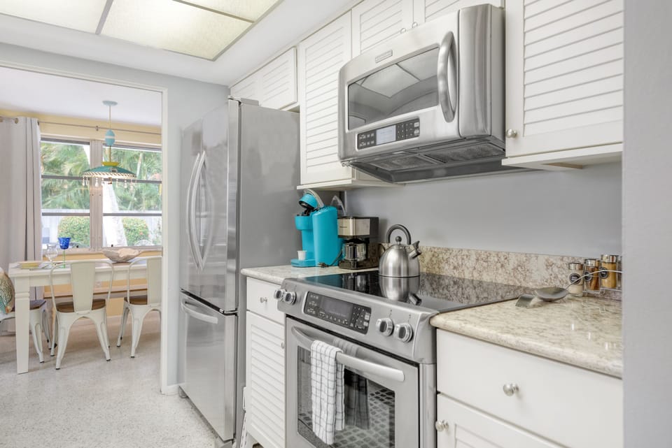 Updated fully equipped kitchen with stainless appliances
