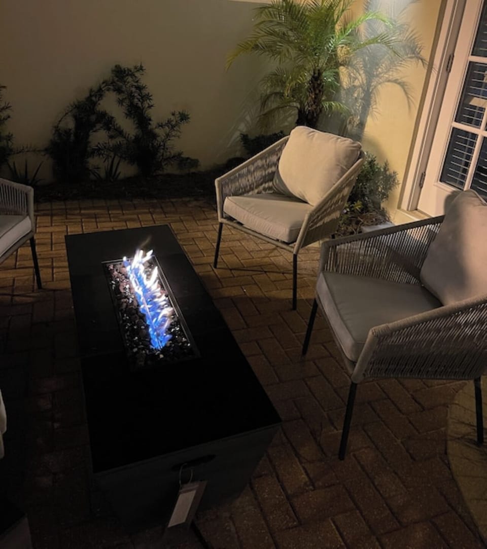 Patio fire place at night.