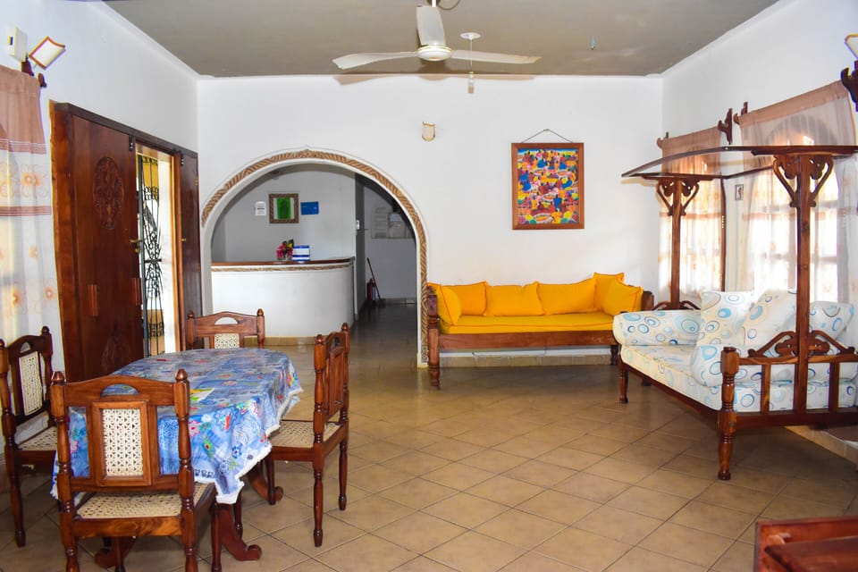 Twin Room | Living area | Flat-screen TV