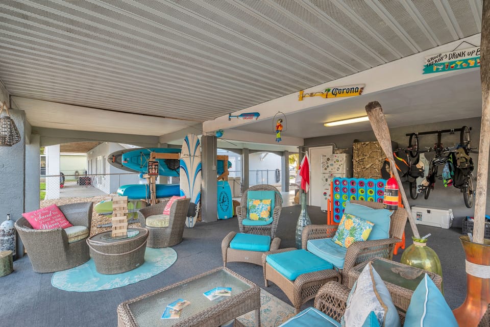 Downstairs patio, three kayaks, and two paddle boards for enjoying the water