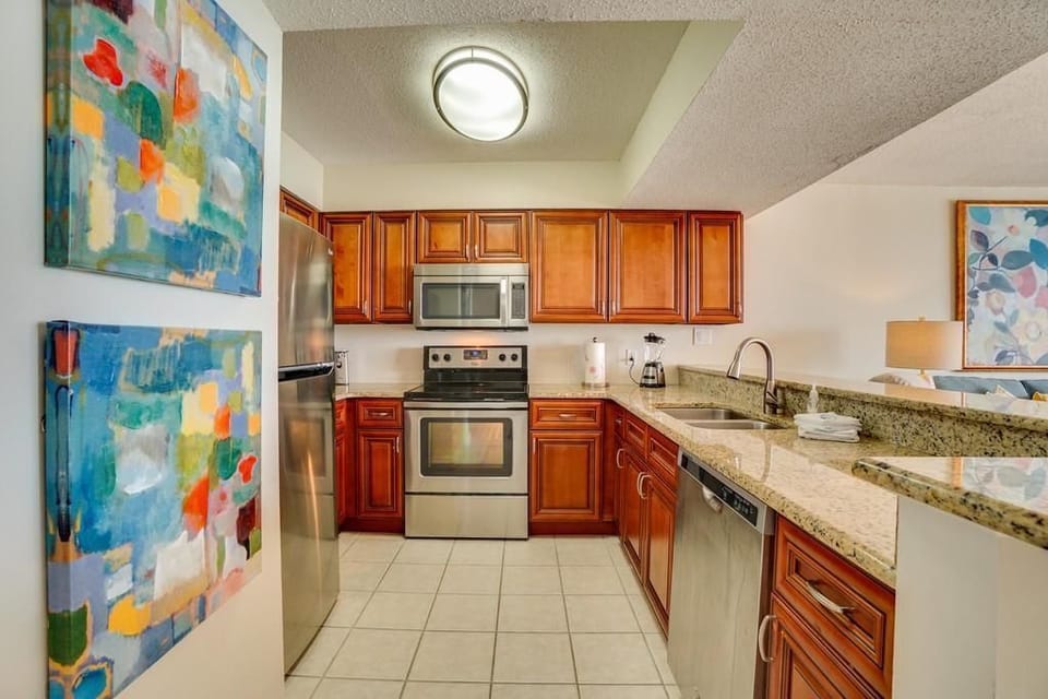 Updated kitchen, stainless applicances, new cabinetry and granite counter top...