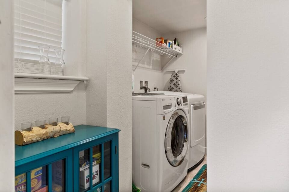 Game cabinet and W/D on main floor.  Detergent and dryer sheets provided.