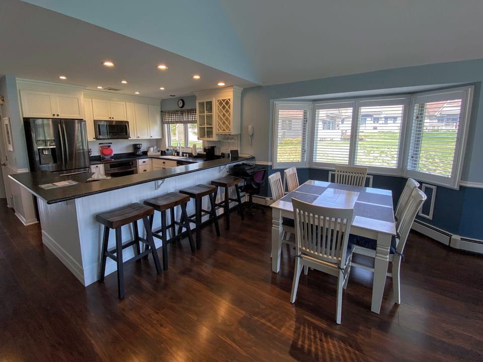 The kitchen is stylish and fully stocked for all your cooking needs and offers stainless steel appliances, a Keurig coffee maker, and cozy breakfast bar that seats 4.