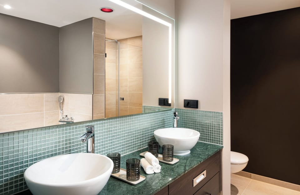Shower, rainfall showerhead, hair dryer, towels