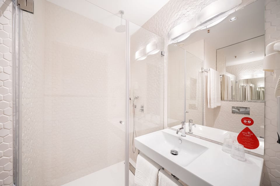 Shower, rainfall showerhead, hair dryer, towels