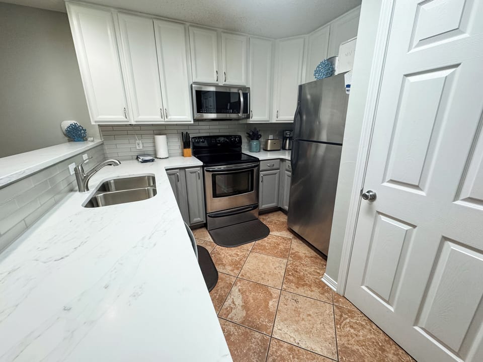Newly remodeled kitchen equipped with everything you need to cook in the condo