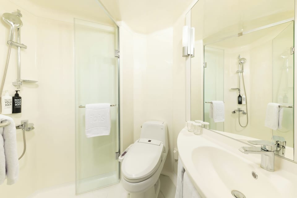 Shower, eco-friendly toiletries, hair dryer, slippers