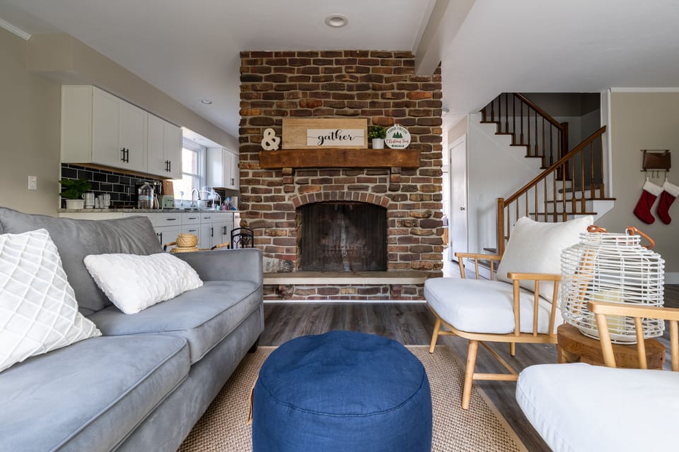 An antique wood burning brick fire place in the center of our family room