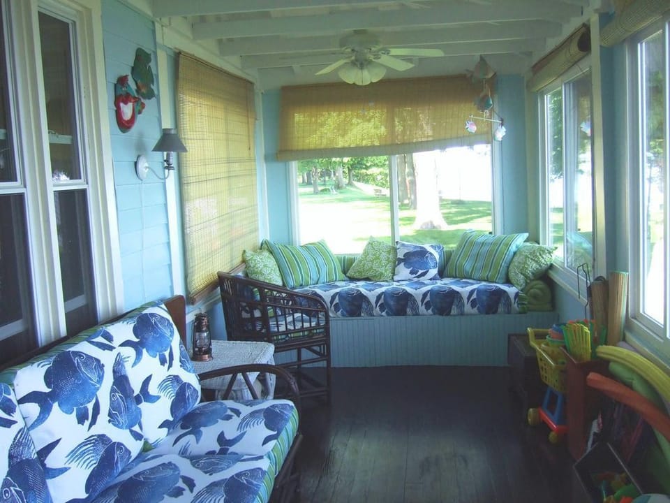 Read a good book or take a snooze on the 2 daybeds on the enclosed porch