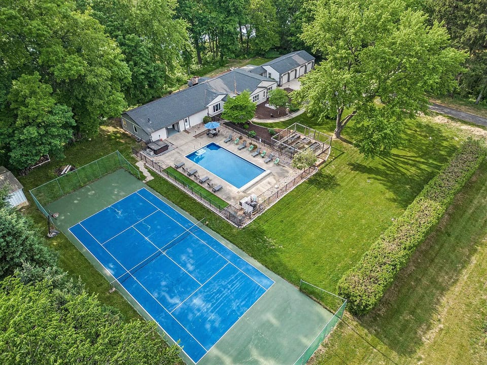 The estate features a private large, newly refinished tennis court.