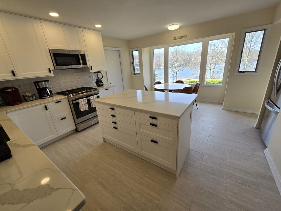 Kitchen with lake views and gas oven and a kitchen table that seats five!