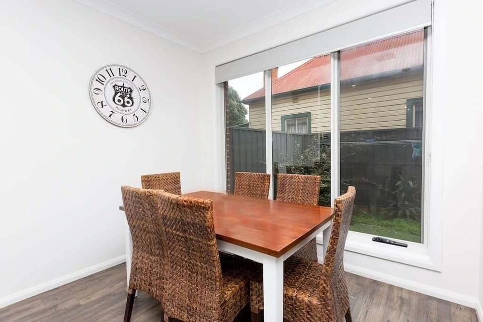 Dining table that seats 6 with views of the outside yard.