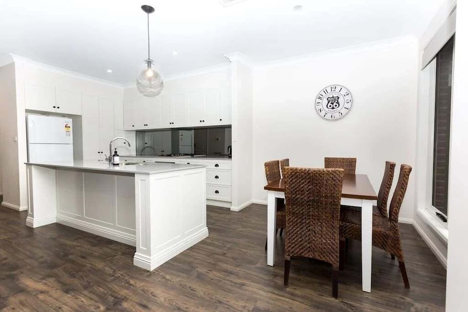 Open plan dining and kitchen space.