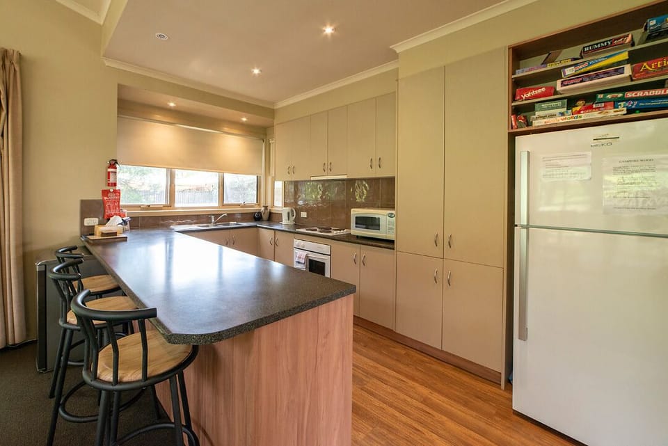 Kitchen fully equipped for convenience.
