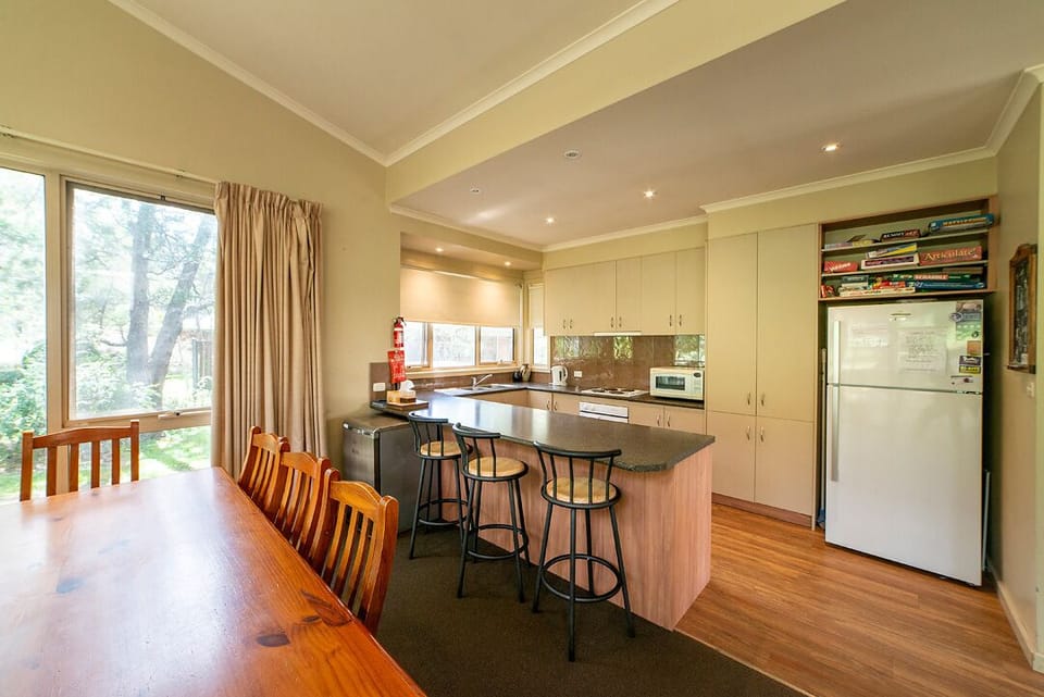 Chic kitchen with stylish bar stools, perfect for casual dining and socializing.